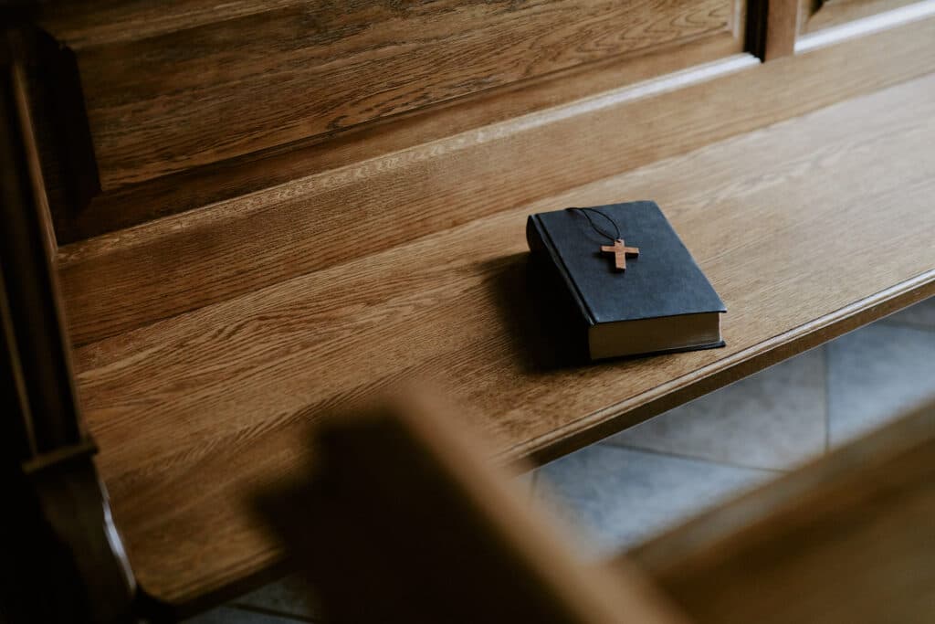 Prayer book on a wooden bench